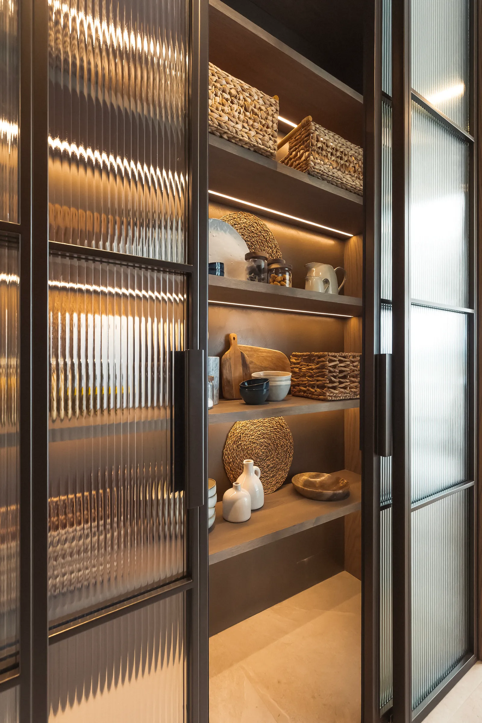 Elmtree Manor, lit display cabinet behind fluted glass