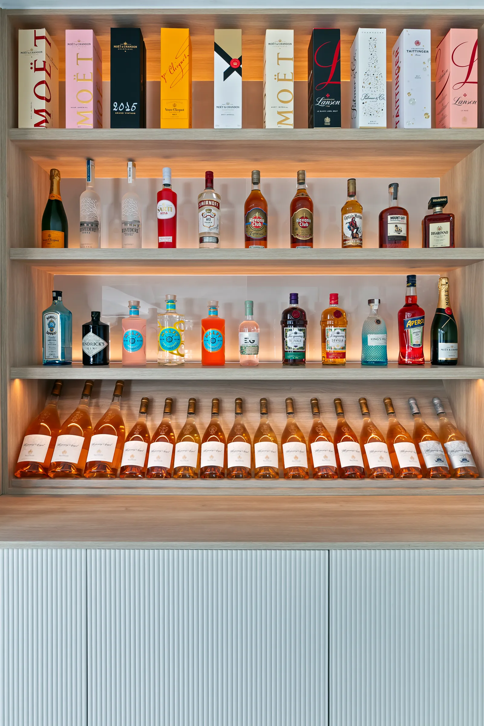 Leathley House, lit drinks wall with open shelving, made in-house