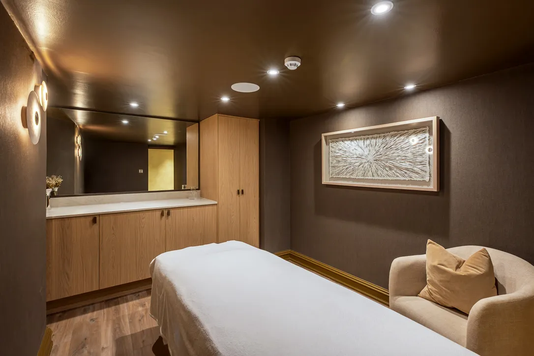 Treatment room with a framed sculptural artwork, art curation in an Ilkley spa fit-out by Dean Heim & Co.