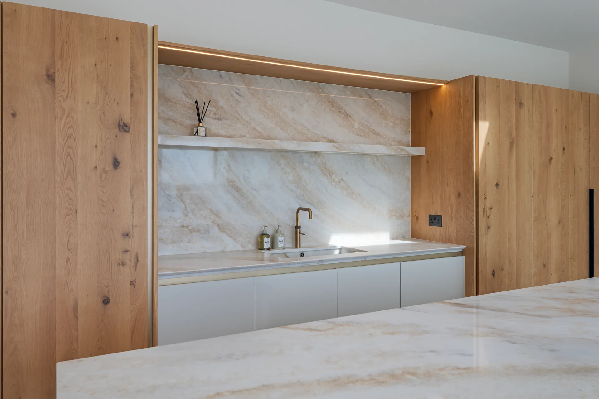 The Hay Barn, Spofforth, kitchen with marble surfaces and oak panelling, interior design by Dean Heim & Co.
